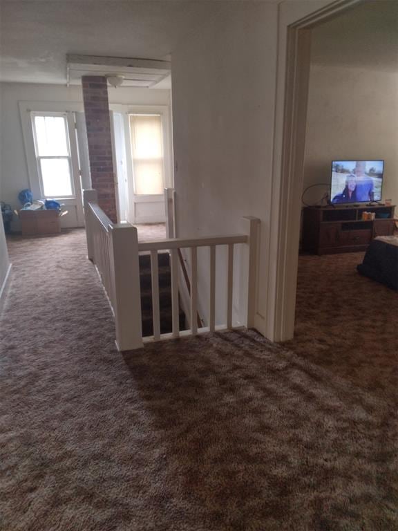 2005 E Cherokee Ave, Enid, OK 73701 - hall featuring an upstairs landing and carpet flooring