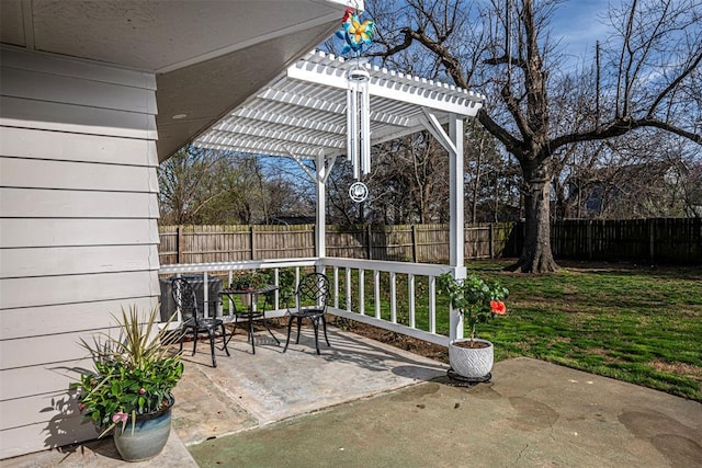 view of patio featuring fence and a pergola