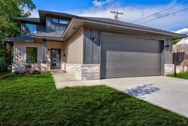 view of front of home with brick siding, a front lawn, fence, concrete driveway, and a garage
