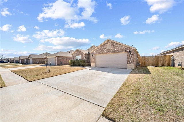 ranch-style house with brick siding, driveway, a garage, and a gate