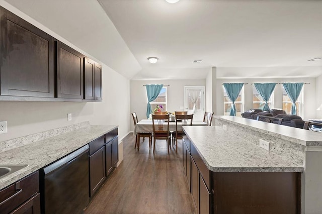 kitchen with dishwasher, dark brown cabinets, and open floor plan