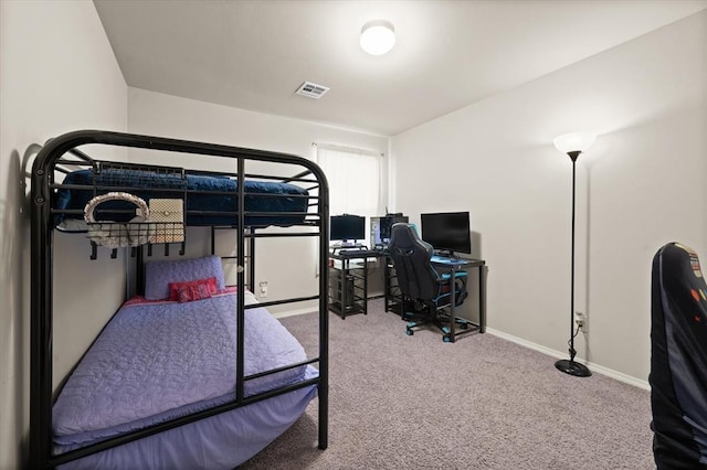 carpeted bedroom with baseboards and visible vents