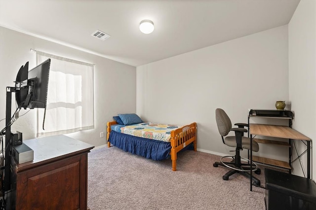 carpeted bedroom featuring visible vents and baseboards