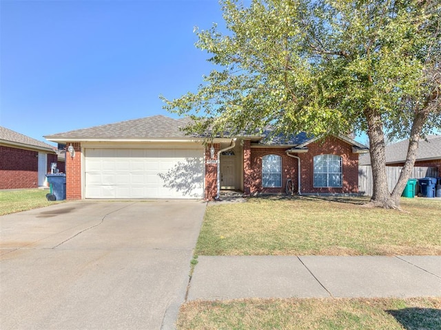 ranch-style home featuring a garage, brick siding, concrete driveway, and a front yard