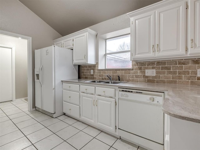kitchen with backsplash, white cabinetry, white appliances, light tile patterned flooring, and light countertops