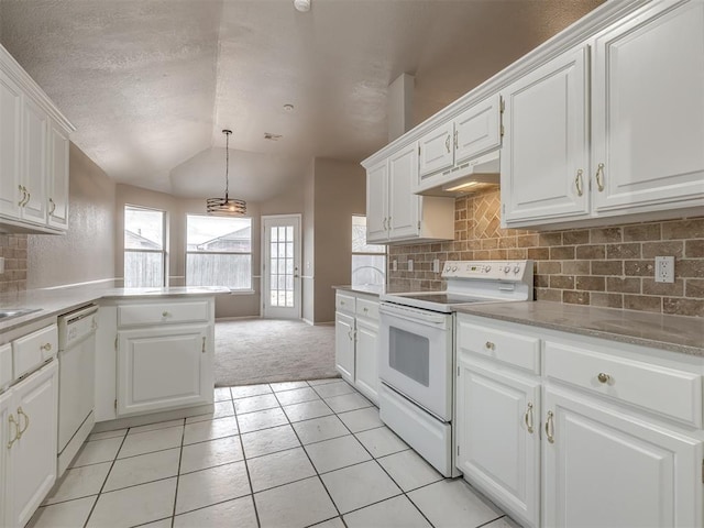 kitchen featuring under cabinet range hood, white appliances, white cabinetry, and lofted ceiling