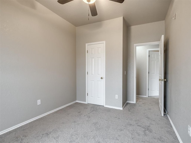 unfurnished bedroom with baseboards, ceiling fan, and carpet flooring