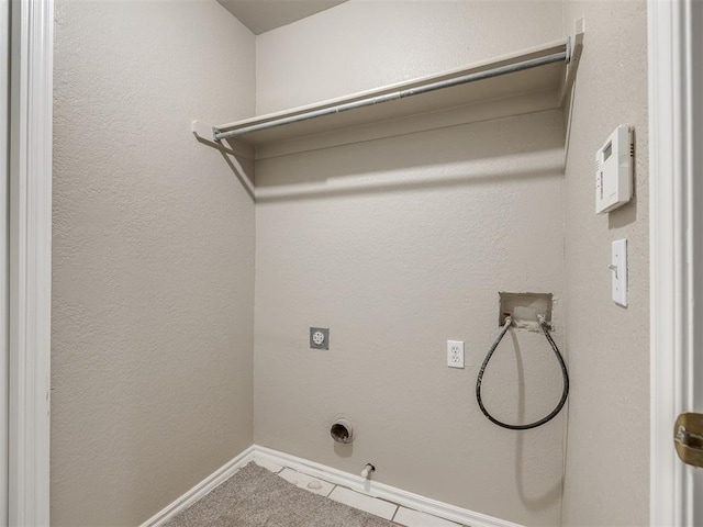 clothes washing area featuring washer hookup, gas dryer hookup, baseboards, hookup for an electric dryer, and laundry area
