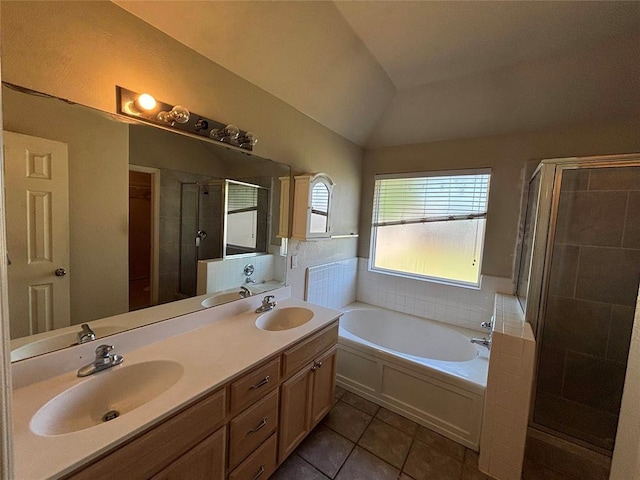 full bath featuring tile patterned flooring, a sink, and a shower stall