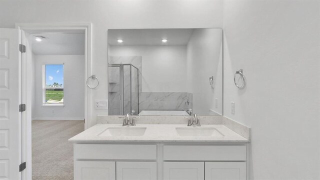 5502 Windstone Ln, Norman, OK 73072 - bathroom with a shower stall and double vanity