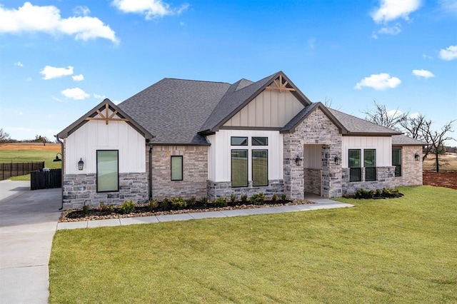 2215 Winter Creek Blvd, Blanchard, OK 73010 - view of front of home featuring a front lawn, fence, board and batten siding, and roof with shingles
