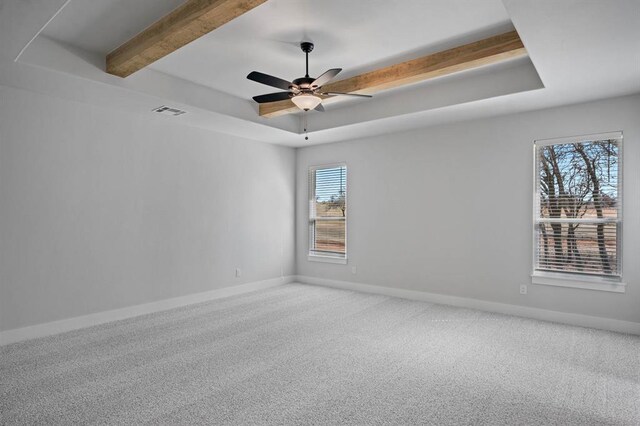 2215 Winter Creek Blvd, Blanchard, OK 73010 - carpeted empty room featuring a raised ceiling, a ceiling fan, baseboards, and visible vents