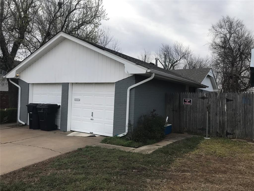 1310 SW 77th Ter, Oklahoma City, OK 73159 - garage featuring fence