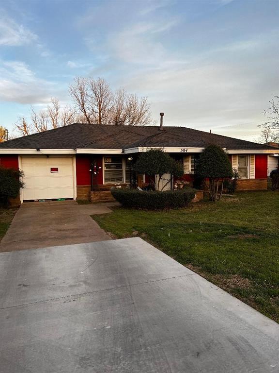 504 N Midwest Blvd, Midwest City, OK 73110 - ranch-style house with a garage, driveway, and a front yard