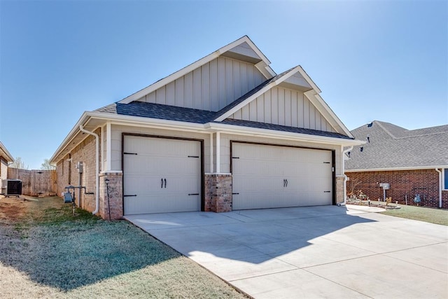 1624 NE 32nd St, Moore, OK 73160 - view of front of property featuring board and batten siding, a garage, brick siding, concrete driveway, and a shingled roof
