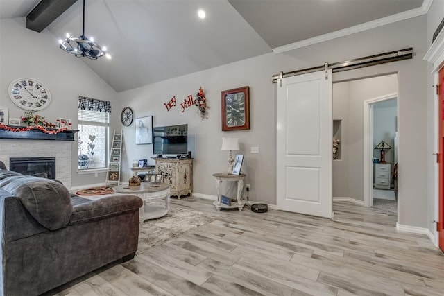 1624 NE 32nd St, Moore, OK 73160 - living room with high vaulted ceiling, a fireplace, beamed ceiling, a barn door, and light wood-type flooring