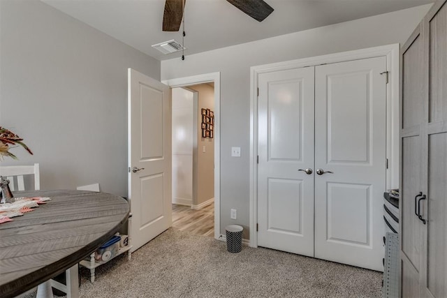 1624 NE 32nd St, Moore, OK 73160 - bedroom featuring light colored carpet, a closet, and a ceiling fan