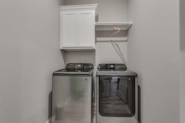 1624 NE 32nd St, Moore, OK 73160 - laundry room featuring cabinet space and independent washer and dryer