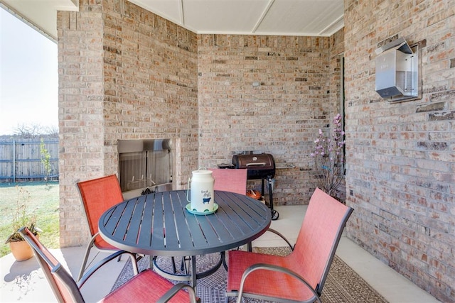 1624 NE 32nd St, Moore, OK 73160 - view of patio / terrace with outdoor dining area and an outdoor brick fireplace