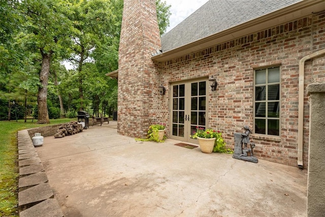 1514 Duxsford Ct, Edmond, OK 73034 - view of patio featuring french doors and a grill
