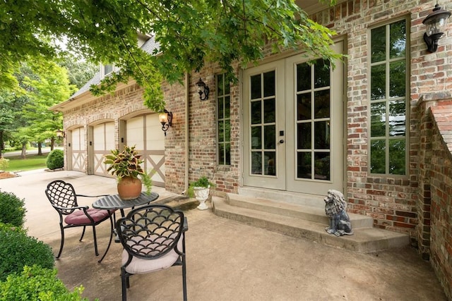 1514 Duxsford Ct, Edmond, OK 73034 - view of patio / terrace featuring french doors and driveway