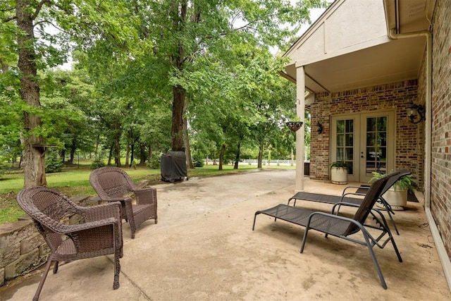 1514 Duxsford Ct, Edmond, OK 73034 - view of patio featuring french doors and grilling area