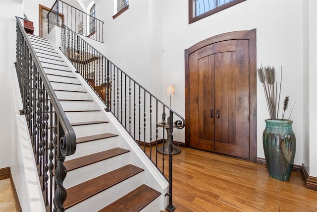 1514 Duxsford Ct, Edmond, OK 73034 - foyer with wood finished floors, stairway, and a high ceiling