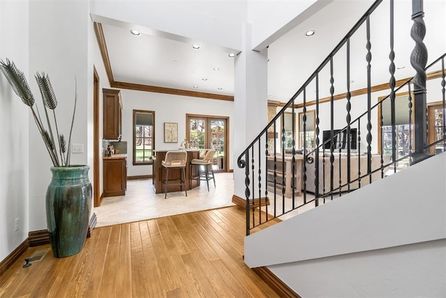 1514 Duxsford Ct, Edmond, OK 73034 - staircase featuring wood-type flooring, ornamental molding, and recessed lighting