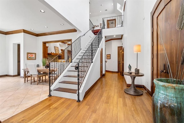 1514 Duxsford Ct, Edmond, OK 73034 - staircase with ornamental molding, wood finished floors, and recessed lighting