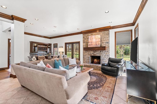 1514 Duxsford Ct, Edmond, OK 73034 - living area with light tile patterned floors, healthy amount of natural light, recessed lighting, crown molding, and a fireplace
