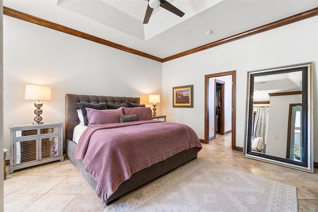 1514 Duxsford Ct, Edmond, OK 73034 - bedroom with light tile patterned flooring, a tray ceiling, ornamental molding, a walk in closet, and ceiling fan