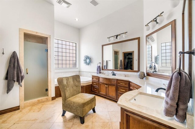 1514 Duxsford Ct, Edmond, OK 73034 - full bath with double vanity, healthy amount of natural light, and a garden tub