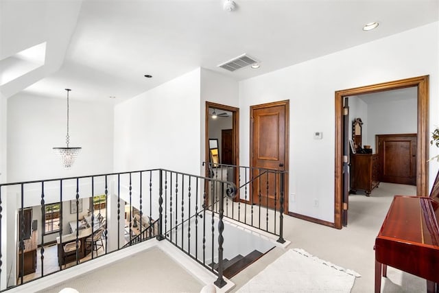 1514 Duxsford Ct, Edmond, OK 73034 - corridor with an upstairs landing, carpet floors, a chandelier, and recessed lighting