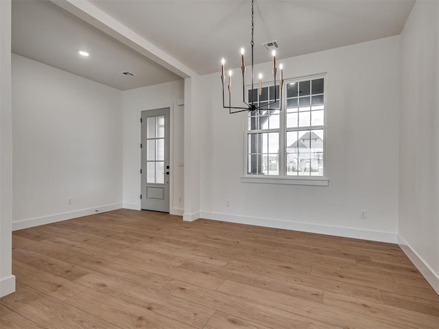 77 Orchid Ct, Piedmont, OK 73078 - unfurnished dining area with a chandelier and light wood-type flooring