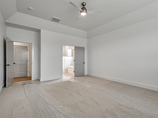 77 Orchid Ct, Piedmont, OK 73078 - unfurnished bedroom with light carpet, connected bathroom, and ceiling fan