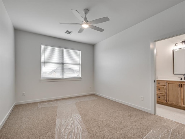 77 Orchid Ct, Piedmont, OK 73078 - unfurnished bedroom featuring light carpet, ensuite bath, and ceiling fan