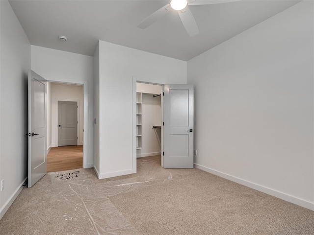 77 Orchid Ct, Piedmont, OK 73078 - unfurnished bedroom with carpet, a spacious closet, a closet, and ceiling fan