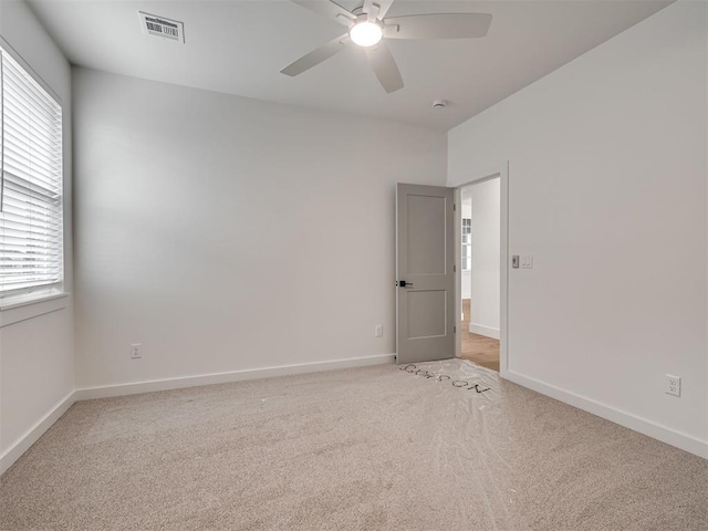 77 Orchid Ct, Piedmont, OK 73078 - unfurnished room featuring light carpet, ceiling fan, plenty of natural light, and a smoke detector