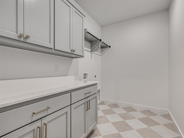 77 Orchid Ct, Piedmont, OK 73078 - laundry area with cabinet space, light flooring, hookup for a washing machine, and hookup for an electric dryer