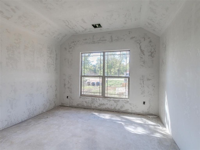 9070 Oak Tree Cir, Edmond, OK 73025 - spare room featuring vaulted ceiling