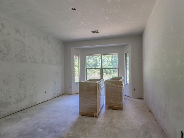 9070 Oak Tree Cir, Edmond, OK 73025 - unfurnished room featuring visible vents and unfinished concrete flooring