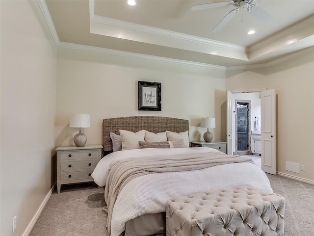 bedroom with light colored carpet, a raised ceiling, and crown molding