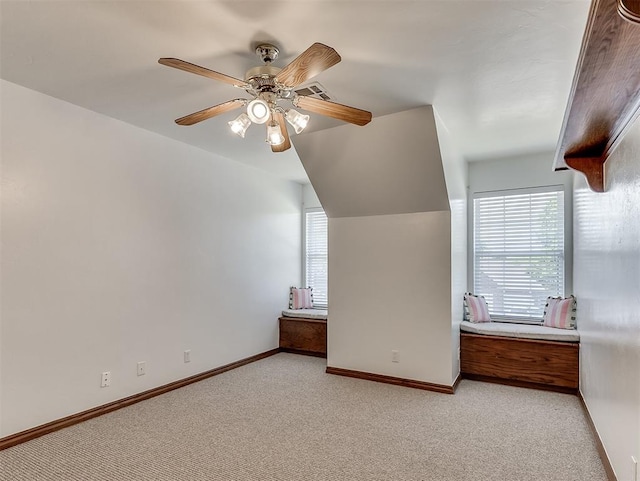 bedroom with baseboards, ceiling fan, and light colored carpet