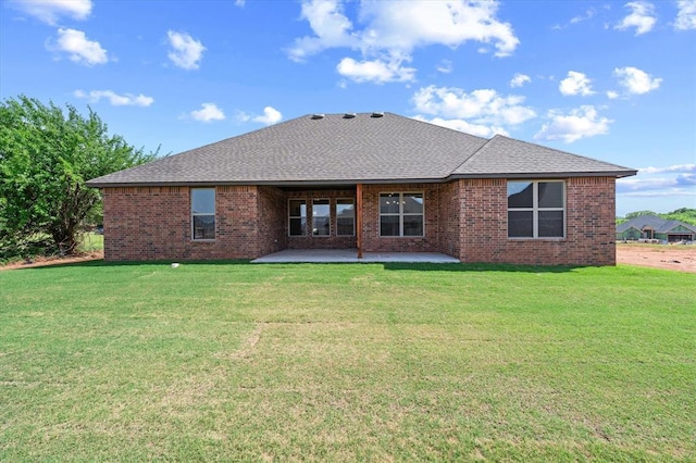 11713 NW 105th St, Yukon, OK 73099 - rear view of house featuring a patio, a yard, a shingled roof, and brick siding