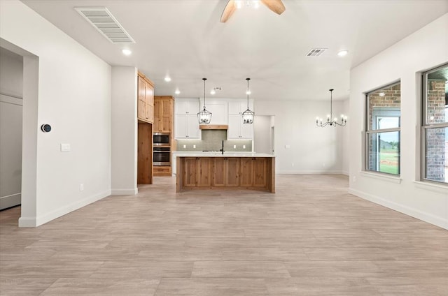 11713 NW 105th St, Yukon, OK 73099 - kitchen with appliances with stainless steel finishes, ceiling fan, recessed lighting, light wood finished floors, and baseboards