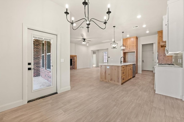 11713 NW 105th St, Yukon, OK 73099 - kitchen with stainless steel appliances, a chandelier, open floor plan, light countertops, and a sink
