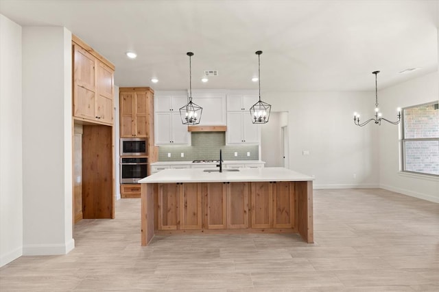 11713 NW 105th St, Yukon, OK 73099 - kitchen featuring stainless steel appliances, a chandelier, light countertops, baseboards, and recessed lighting