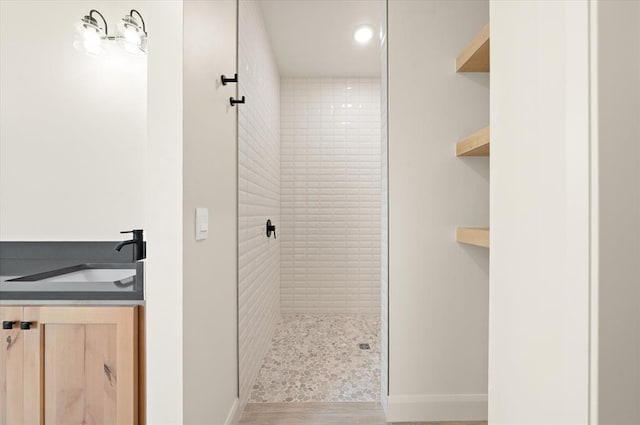 11713 NW 105th St, Yukon, OK 73099 - full bath with a tile shower, vanity, wood finished floors, recessed lighting, and baseboards