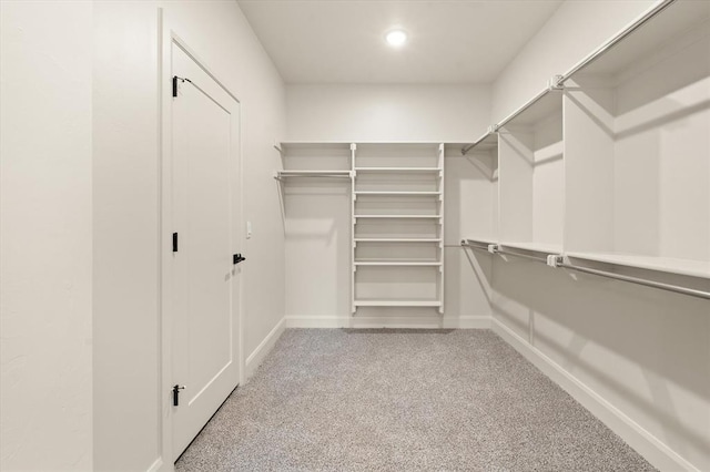 11713 NW 105th St, Yukon, OK 73099 - walk in closet with carpet flooring