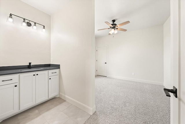 11713 NW 105th St, Yukon, OK 73099 - bathroom with ceiling fan, baseboards, and vanity